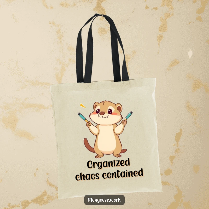 Funny Mongoose Tote Bag, a creative design of a concentrated mongoose playfully tossing several pens high in the air.